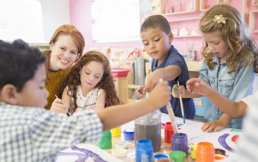 a group of children painting