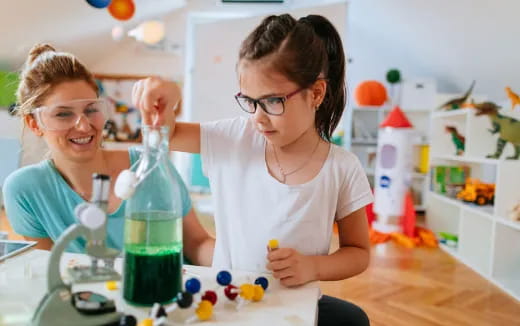 a couple of women in a kitchen