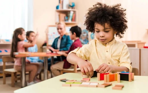 a young boy sitting at a table