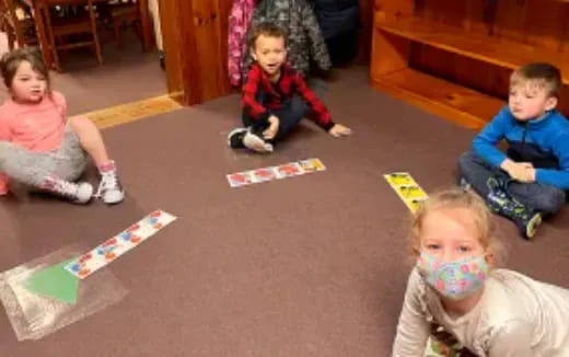 a group of children playing with toys