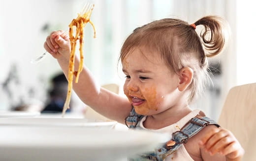 a baby playing with a toy