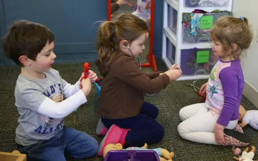 a group of children playing with toys