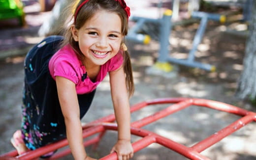 a young girl smiling