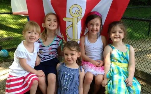 a group of girls posing for a photo