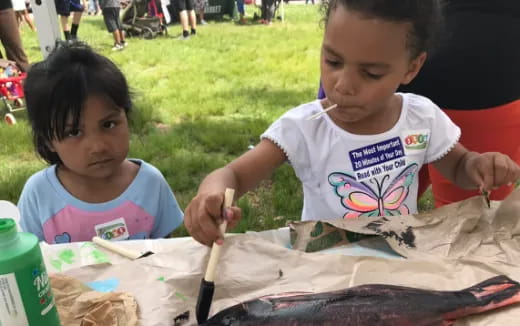 a couple of young girls painting