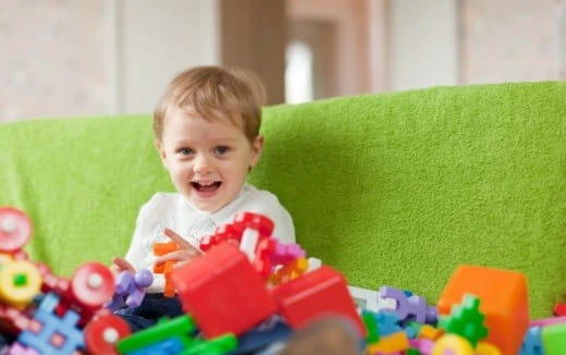 a baby sitting on a couch