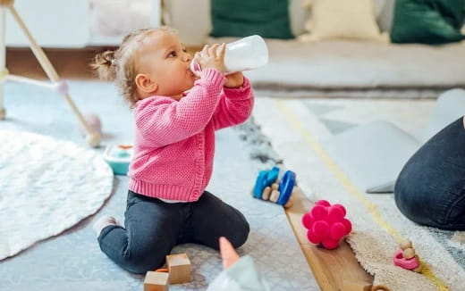 a baby drinking from a bottle