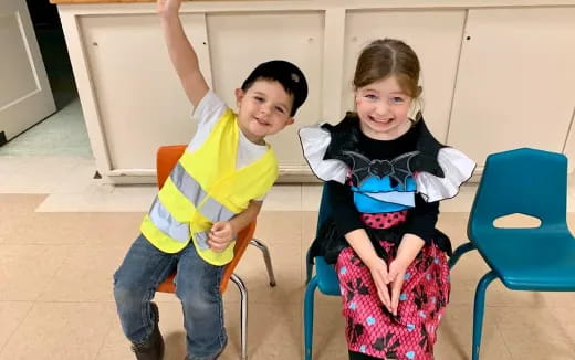 a boy and girl posing for a picture
