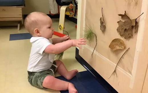 a baby playing with a toy