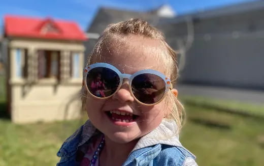a child wearing sunglasses
