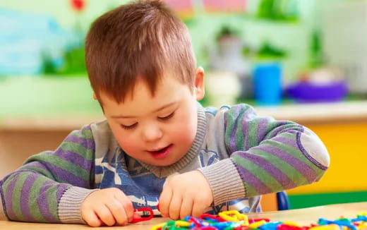 a baby playing with toys