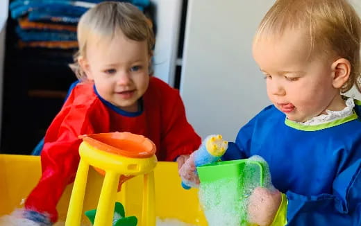 two children sitting at a table