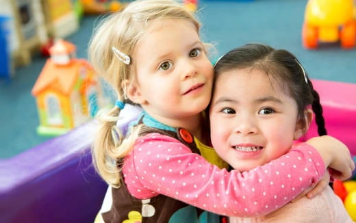 a couple of girls posing for the camera