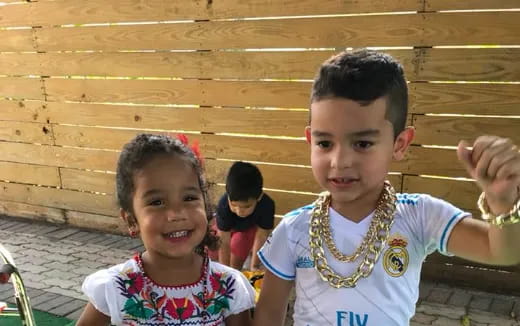 a couple of children posing for the camera