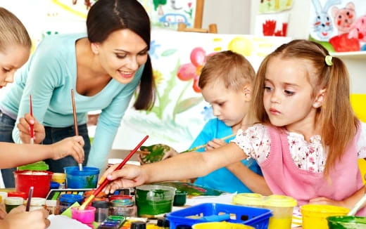 a person and children painting