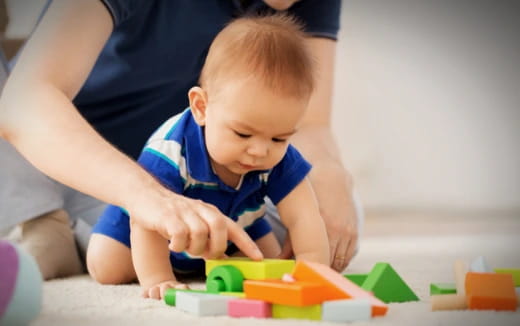 a baby playing with toys