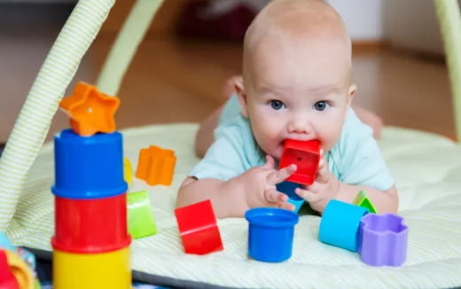 a baby playing with toys