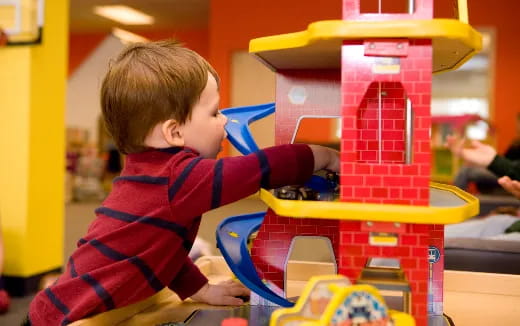 a child playing with a toy