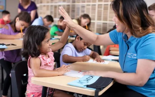 a teacher teaching her students