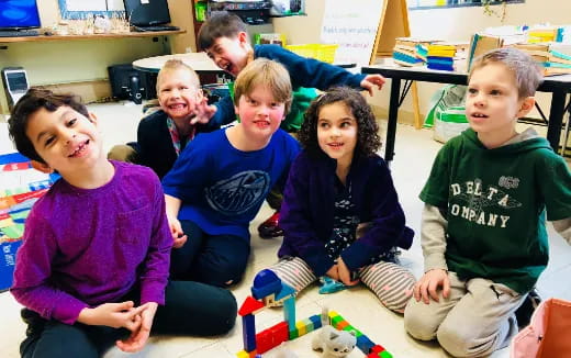 a group of children sitting on the floor