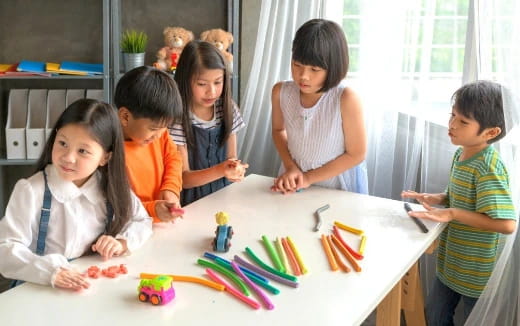 a group of children around a table