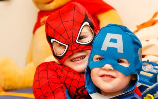 a couple of children wearing clothing