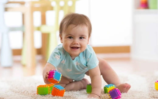 a baby playing with toys