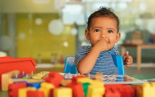 a child sitting at a table
