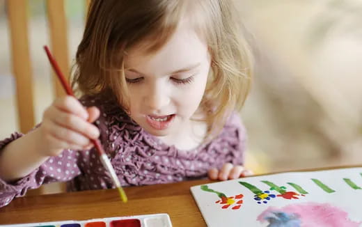 a young girl painting