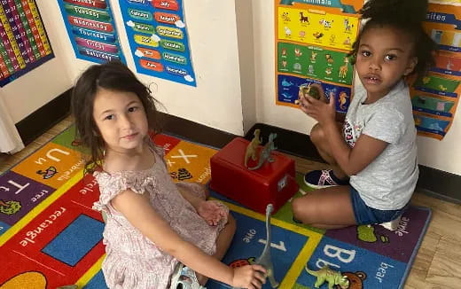 a couple of children playing with toys