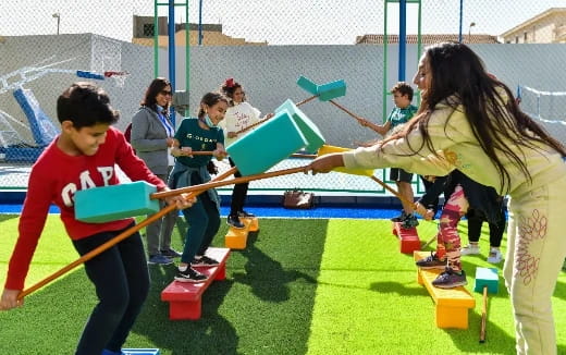 a group of kids playing on a playground