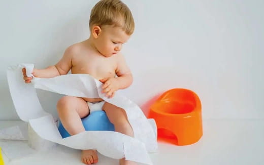 a baby sitting in a high chair