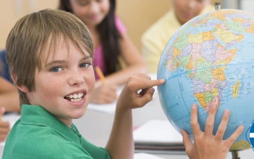 a child holding a drawing