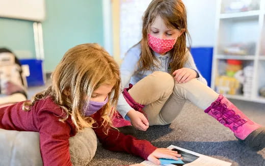 a couple of girls with face paint