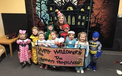 a group of children holding a sign