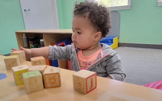 a child playing with blocks