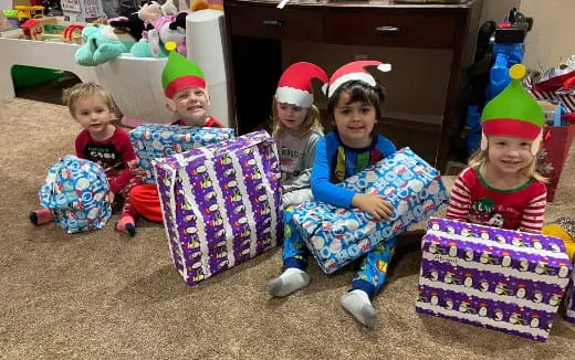 a group of children wearing christmas hats