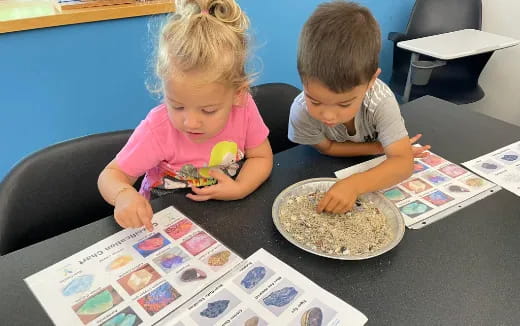 a couple of children eating