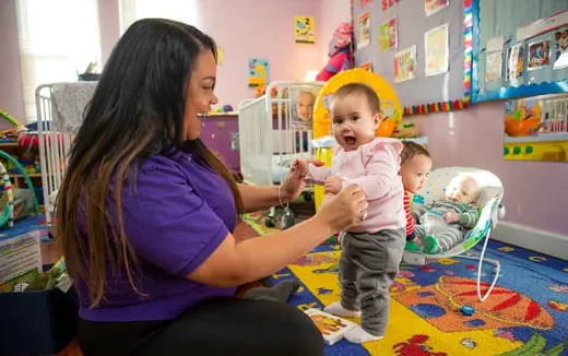 a person holding a baby