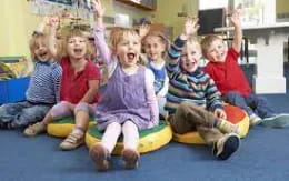 a group of children sitting on the floor
