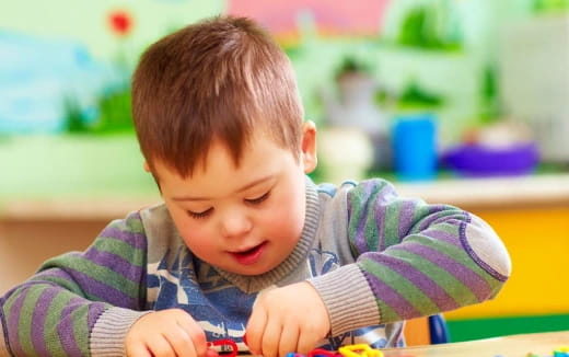 a baby playing with a toy