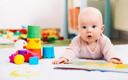 a baby sitting on the floor