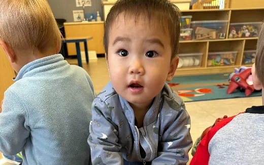 a baby looking at the camera