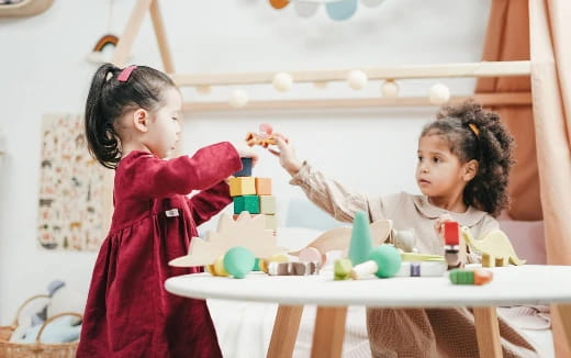 a couple of children playing with toys