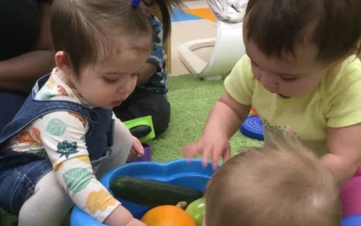a group of children playing with toys