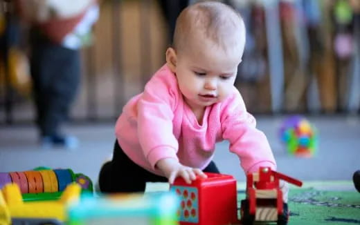 a baby playing with toys