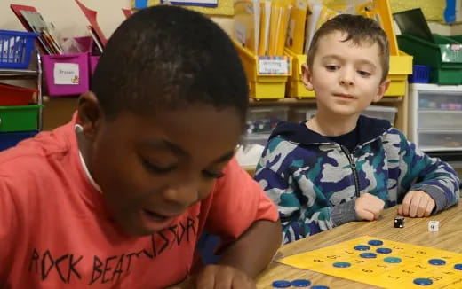 a couple of young boys playing a game