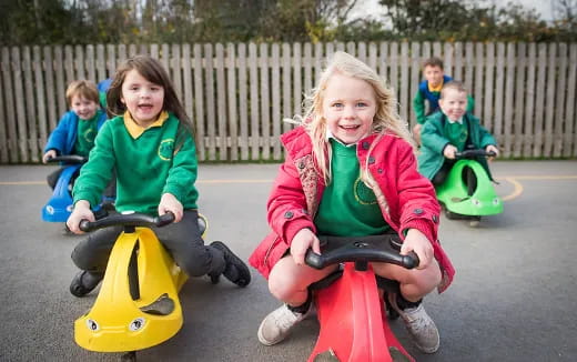 a group of children on small bikes