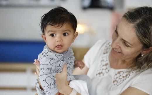 a person holding a baby