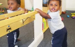 a couple of children playing in a room